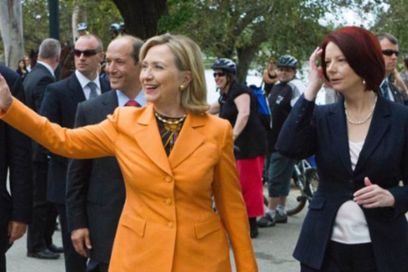 US presidential candidate Hillary Rodham Clinton waves to the crowd during her walk with Australian Prime Minister Julia Gillard, and former US Ambassador to Australia, Jeff Bleich, rear, during a visit to Melbourne on November 7, 2010.