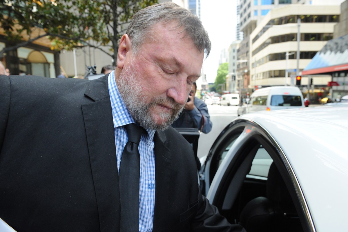 Greg Hughes, the father of cricketer Phillip Hughes, leave the Downing Centre Court in Sydney, Friday, Oct. 14, 2016. The family of Phillip Hughes has left a coroner's court during the closing submissions for a five-day inquest into his death in November 2014, after he was struck on the side of the head by a short-pitched delivery from friend and pace bowler Sean Abbott during a Sheffield Shield match. (AAP Image/Joel Carrett) NO ARCHIVING