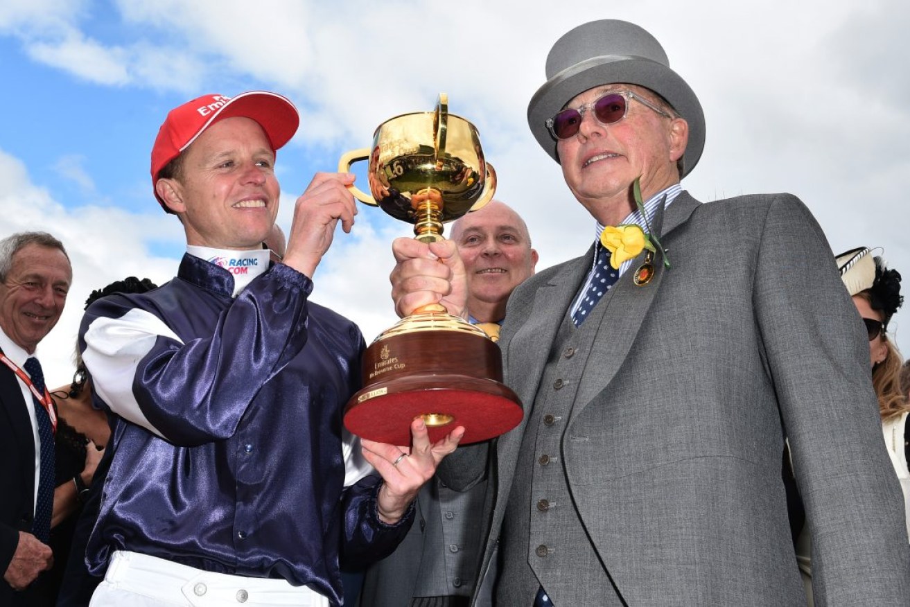 Jockey Kerrin McEvoy and owner Lloyd Williams after Almandin won the 2016 Melbourne Cup. Photo: Julian Smith / AAP