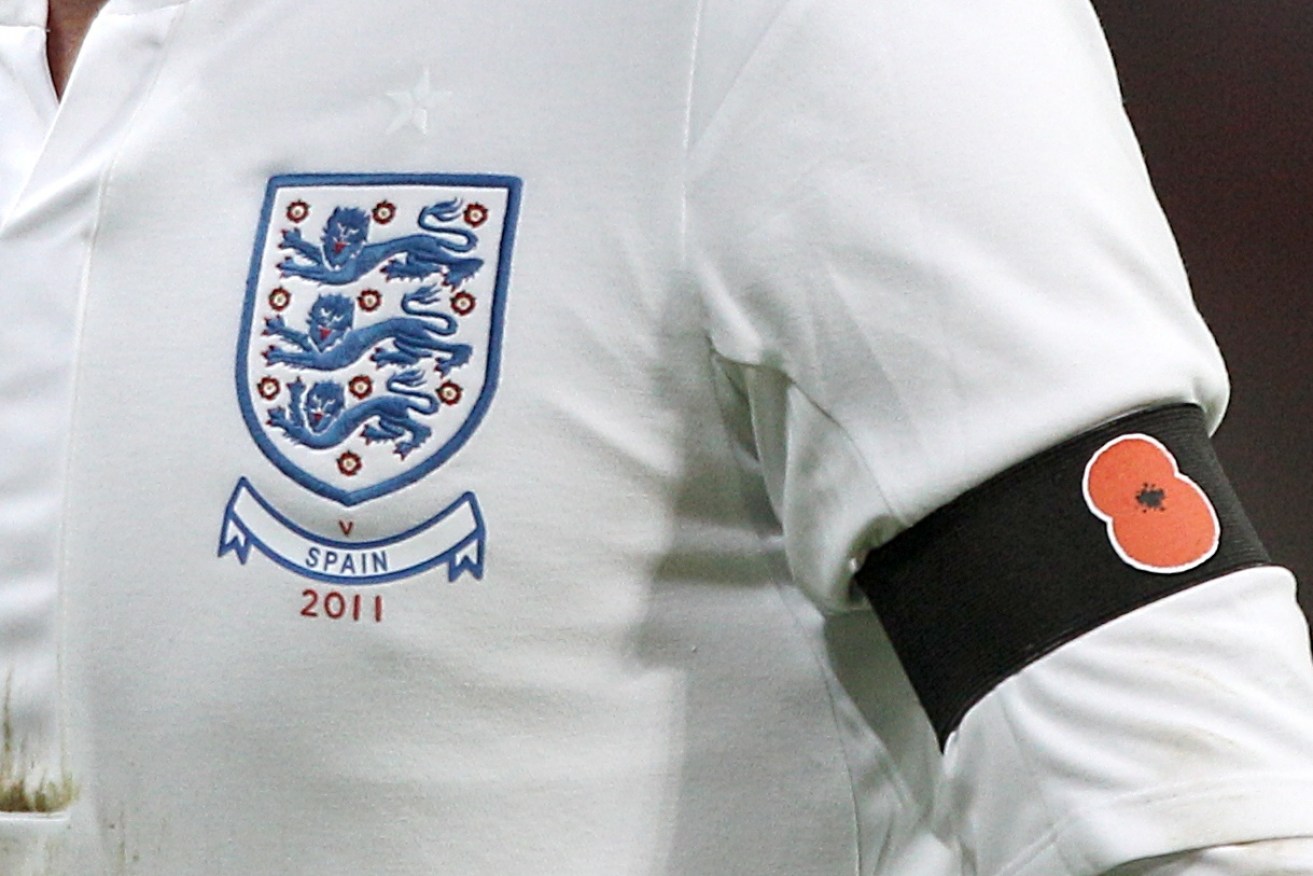 A file photo of an England player wearing a black armband with a poppy symbol. Photo: Nick Potts / PA Wire