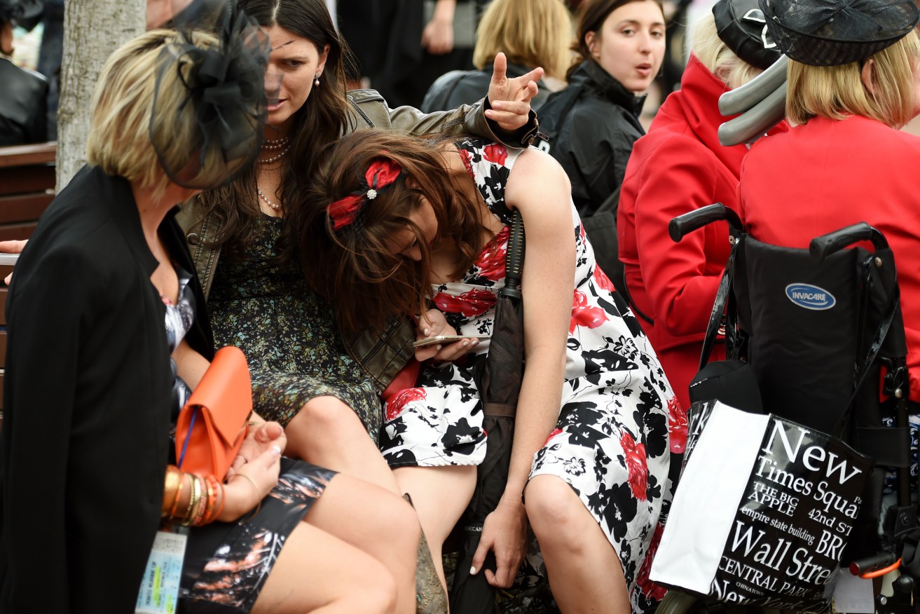 Racegoers at the end of the day at Flemington. Photo: Tracey Nearmy / AAP
