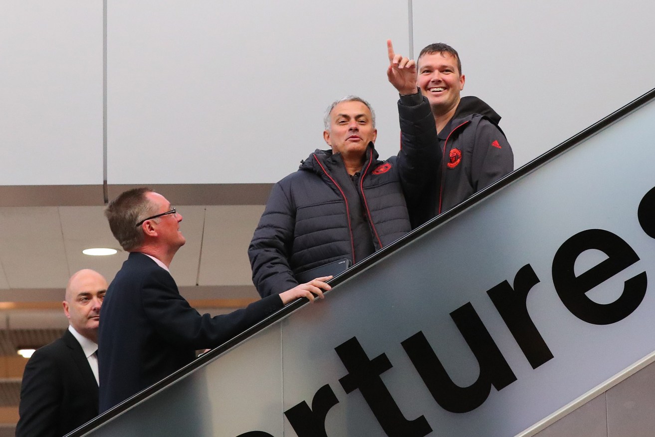 EARLY DEPARTURE? Mourinho's tenure has started more shakily than that of the ill-fated David Moyes...  but he was upbeat as the team flew to Istanbul for their Europa League Match. Photo via AAP.