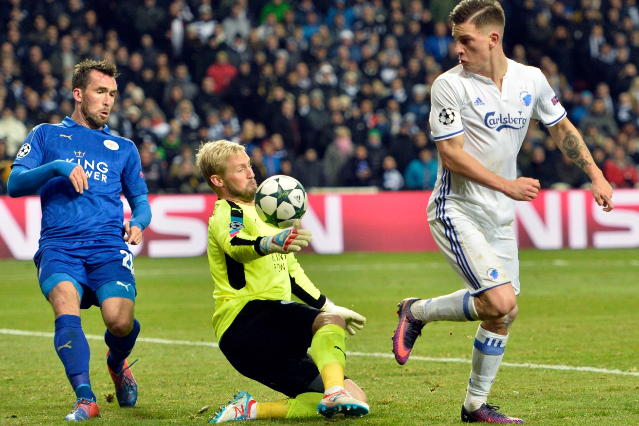 Leicester City's goalkeeper Kasper Schmeichel and FC Copenhagen's Benjamin Verbic, right, battle for the ball during their Champions League fixture at Parken Stadium this morning. Photo: Jens Dresling / Polfoto via AP