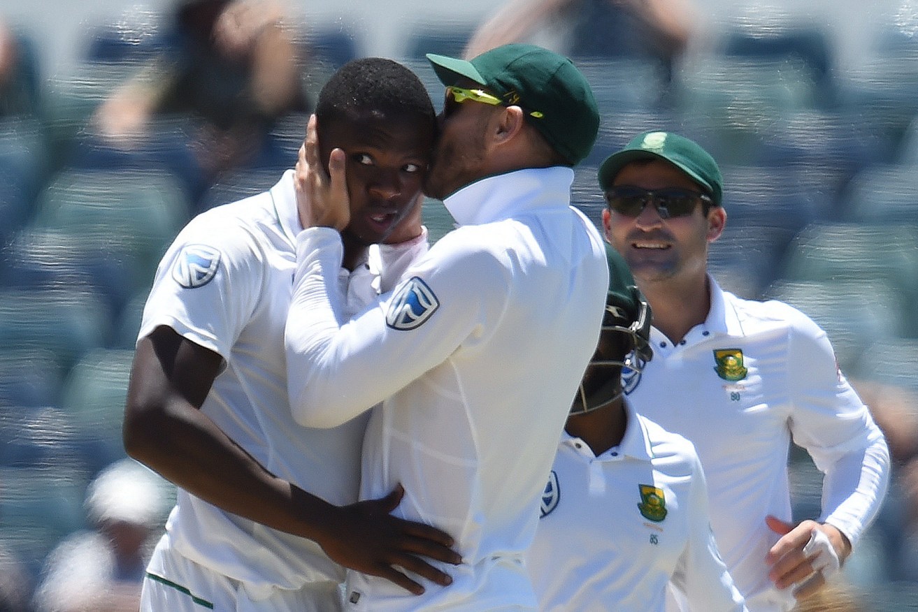South African captain Faf du Plessis kisses man of the match Kagiso Rabada after he took the wicket of Mitchell Starc yesterday. Photo: Dave Hunt / AAP