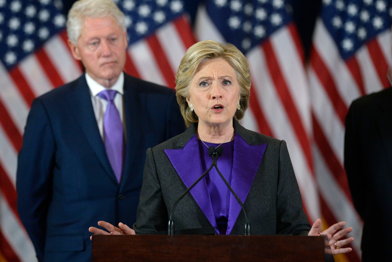 Hillary Clinton concedes the election with husband and former president Bill looking on. Photo: Olivier Douliery/Abaca