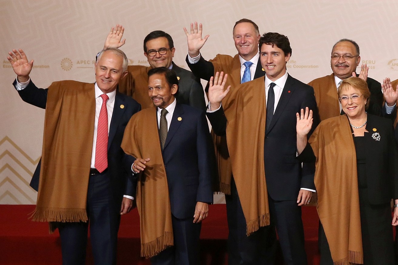 Prime Minister Malcolm Turnbull (far left) with other APEC leaders in Peru on Sunday. Photo: AP/Martin Mejia