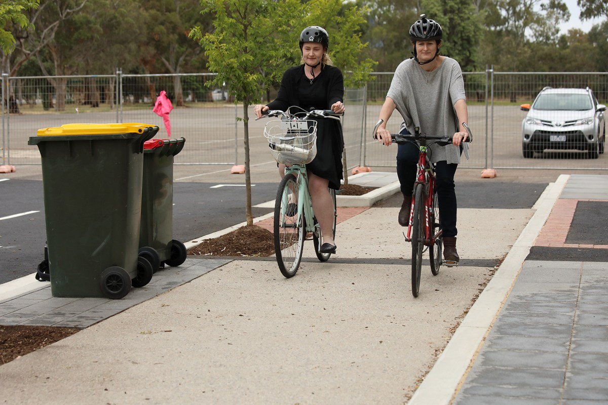 Council admin staff Anna McDonald (grey top) and Stephanie Rogers ride the bike lanes the Adelaide City Council has built in Park 23 in the parklands