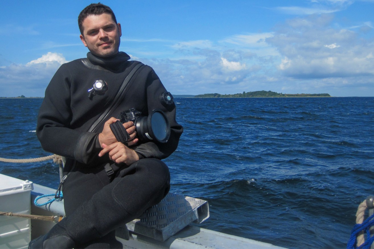 Archaeologist Dr Jonathan Benjamin prepares to record a submerged Mesolithic site in the shallow waters of Denmark, Baltic Sea. Photo courtesy John McCarthy (Flinders University). 