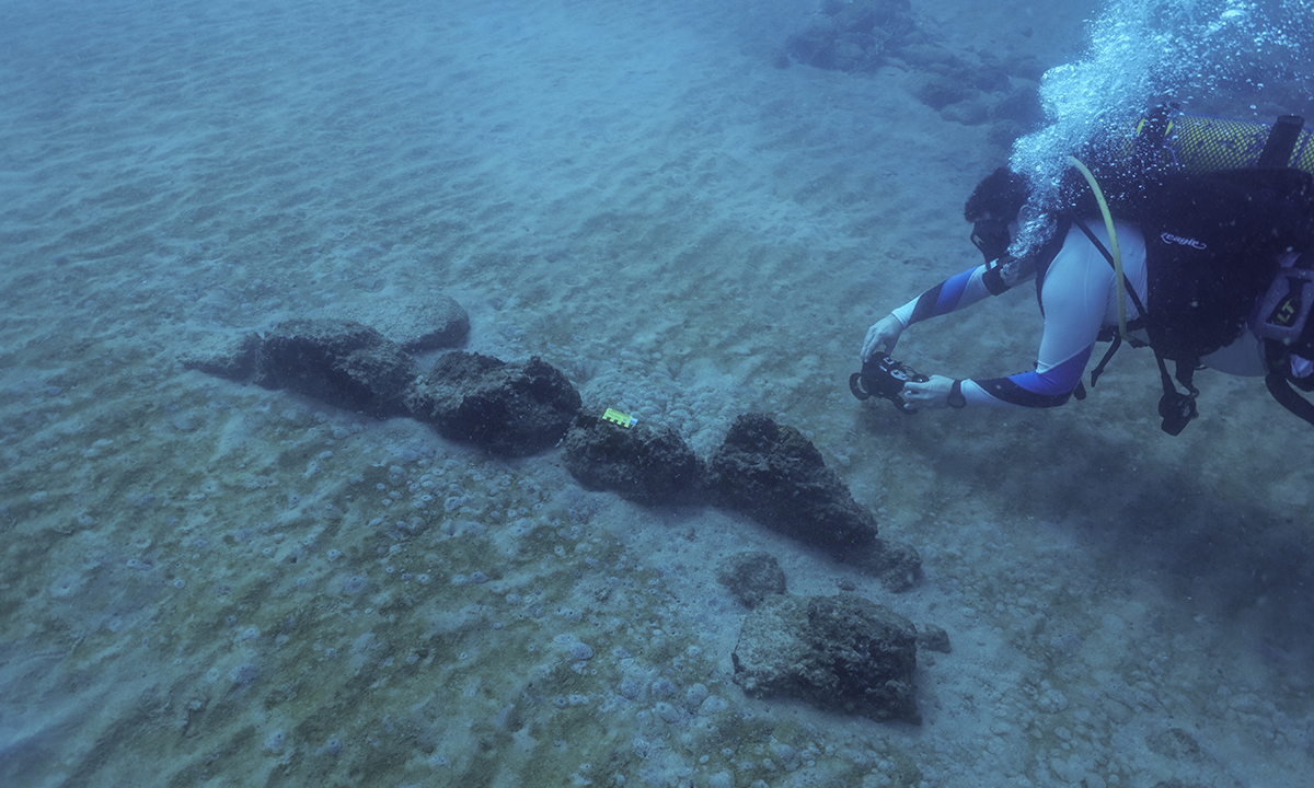 Recording the relics of a 9,000 year old Neolithic village at 10m water depth in the eastern Mediterranean Sea. Photo courtesy Dr Ehud Galili (Haifa University). 