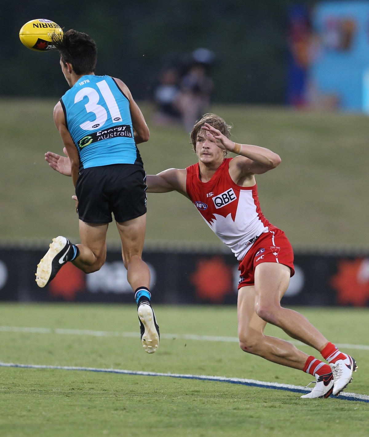 Aidyn Johnson of the Power takes a mark beating Brandon Jack of the Swans during the AFL NAB Challenge fixture between the Sydney Swans and Port Adelaide Power at Blacktown International Sports Park in Sydney, Saturday, Feb. 20, 2016. (AAP Image/Craig Golding) NO ARCHIVING, EDITORIAL USE ONLY