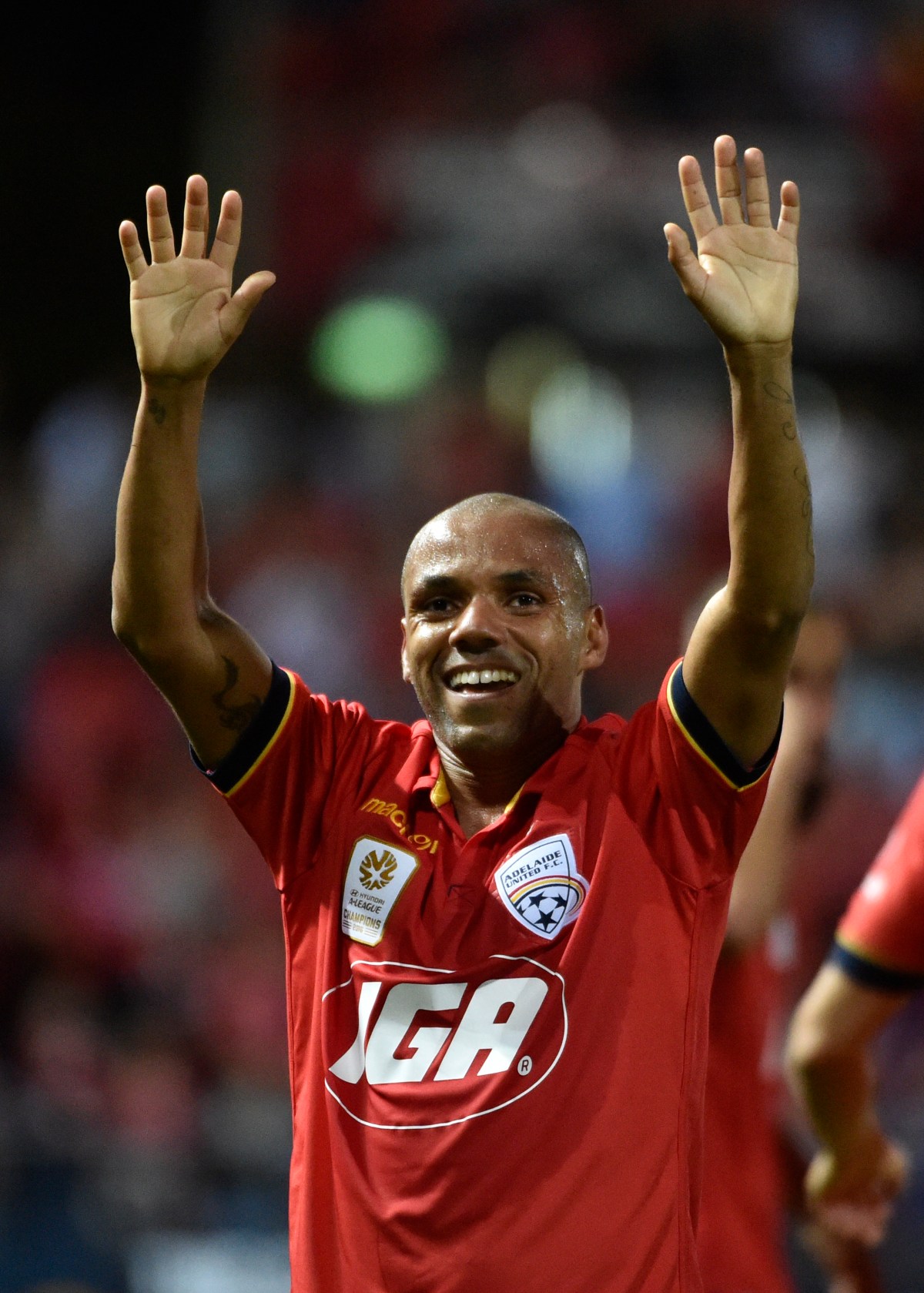 Henrique Adriano Buss of United celebrates his goal during the Round 2 A-League match between Adelaide United and the Western Sydney Wanderers at Cooper Stadium in Adelaide, Friday, Oct. 14, 2016. (AAP Image/David Mariuz) NO ARCHIVING, EDITORIAL USE ONLY