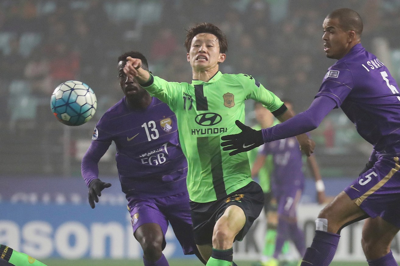 Jeonbuk Hyundai Motors player Lee Jae-sung fights for the ball during the first leg of the Asian Champions League final in South Korea last month. Adelaide United will have to contend with the champions. Photo: Choe Young-soo / Yonhap via AP