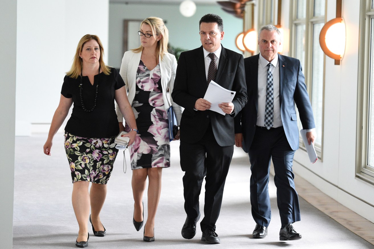 Nick Xenophon with his federal parliamentary 'Team': Member for Mayo Rebekha Sharkie and senators Skye Kakoschke-Moore and Stirling Griff. Photo: Mick Tsikas / AAP