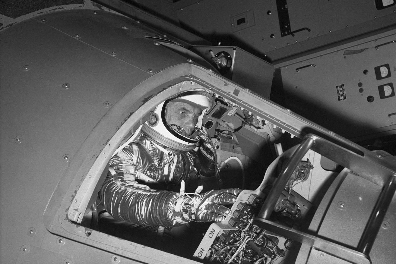 A 1961 image of John Glenn inside a Mercury capsule trainer. Photo: AP