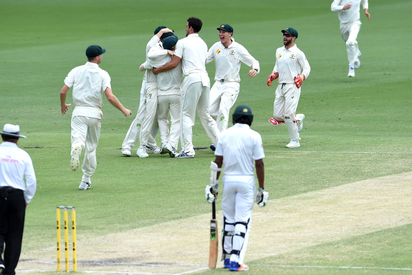 Australian players celebrate narrowly defeating Pakistan on day five of the day-night Test. Photo: Dan Peled / AAP