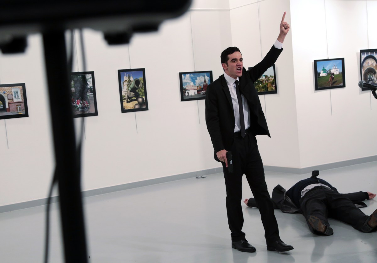 The gunman shouts after shooting Andrei Karlov, the Russian Ambassador to Turkey, at a photo gallery in Ankara, Turkey. Photo: AP /Burhan Ozbilici)