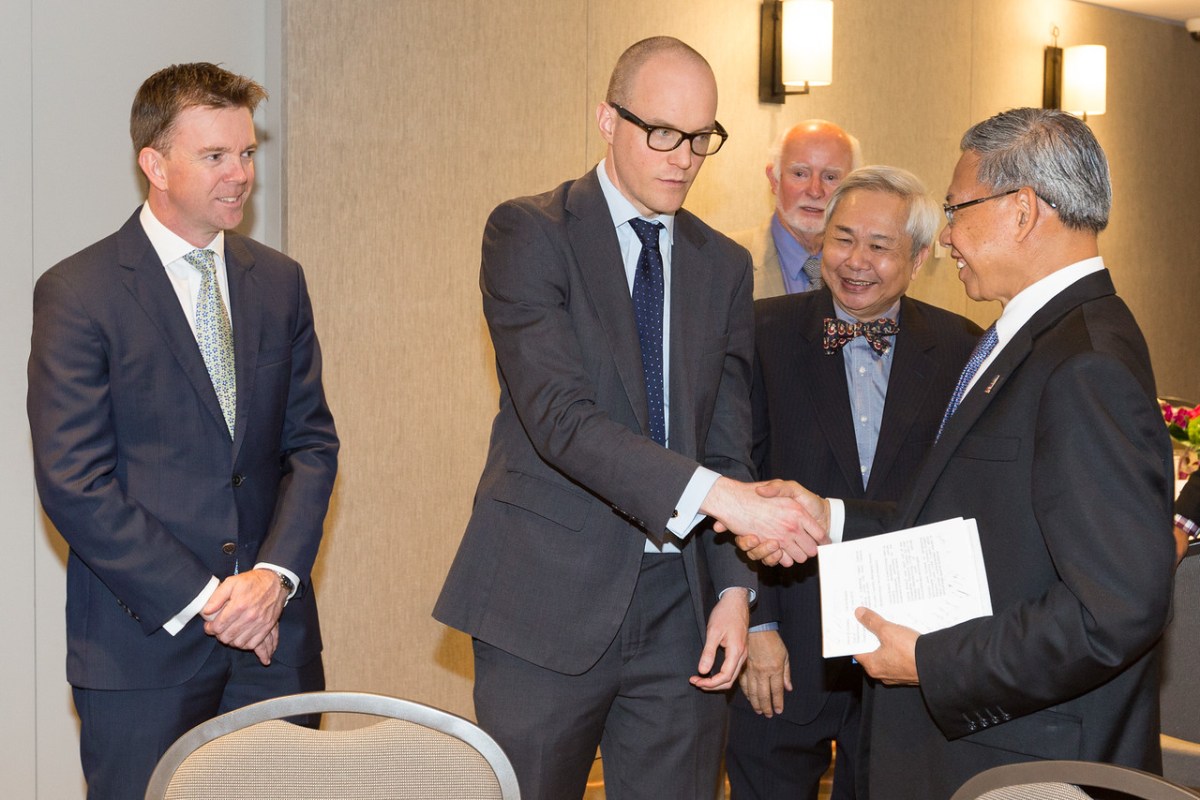 Dave Gordge , State Director of DFAT is shaking hands with the Malaysian Minister for International Trade and Investment The Honourable Dato Seri Mustapa Mohammed. Photo: Andrew Beveridge