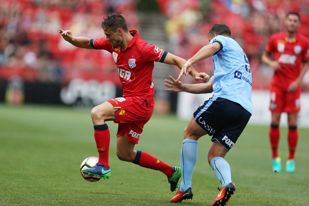 James Holland in action for United. Photo: James Elsby / AAP