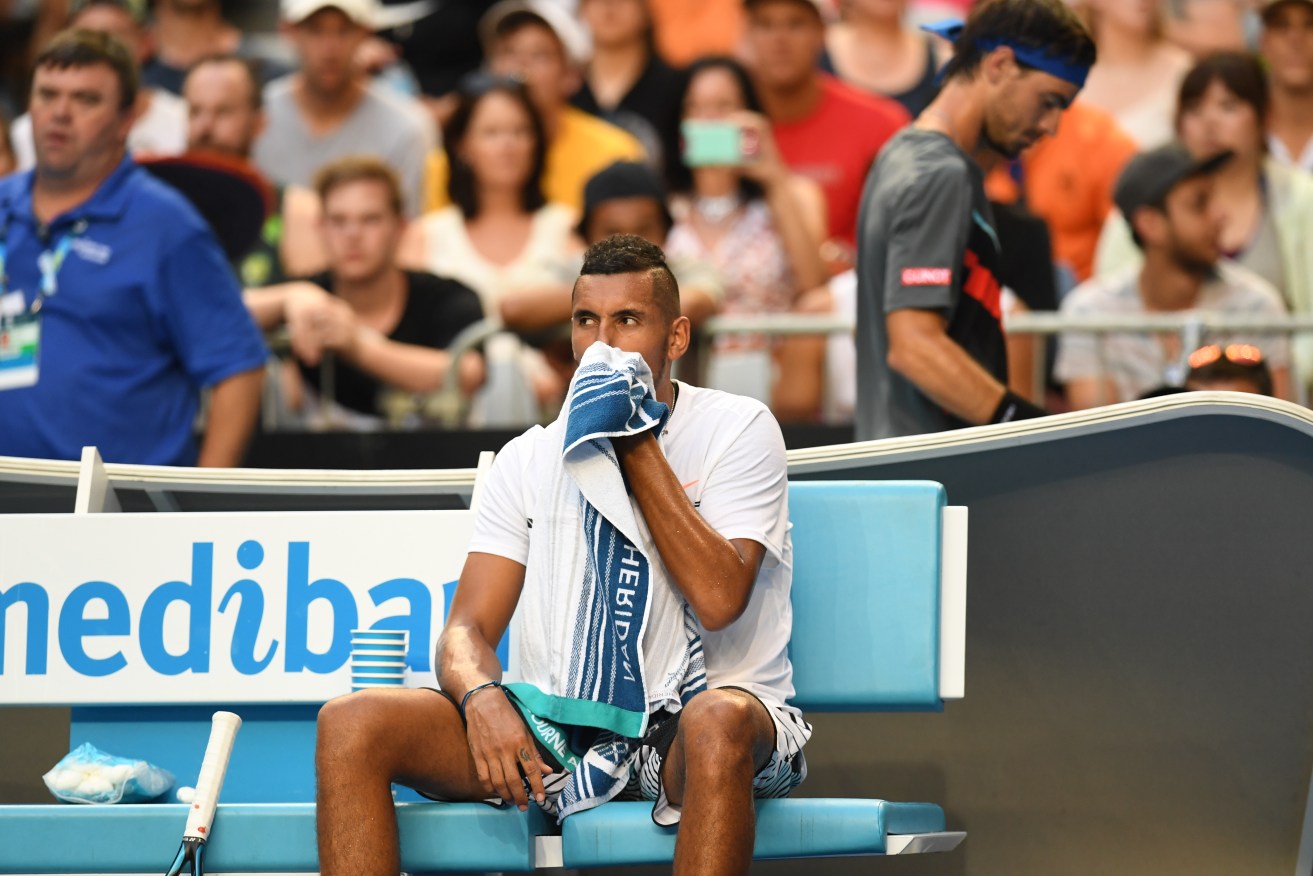 Nick Kyrgios sits out during his match against Gastao Elias amid a bout of nose bleeds. Photo: Dean Lewins / AAP