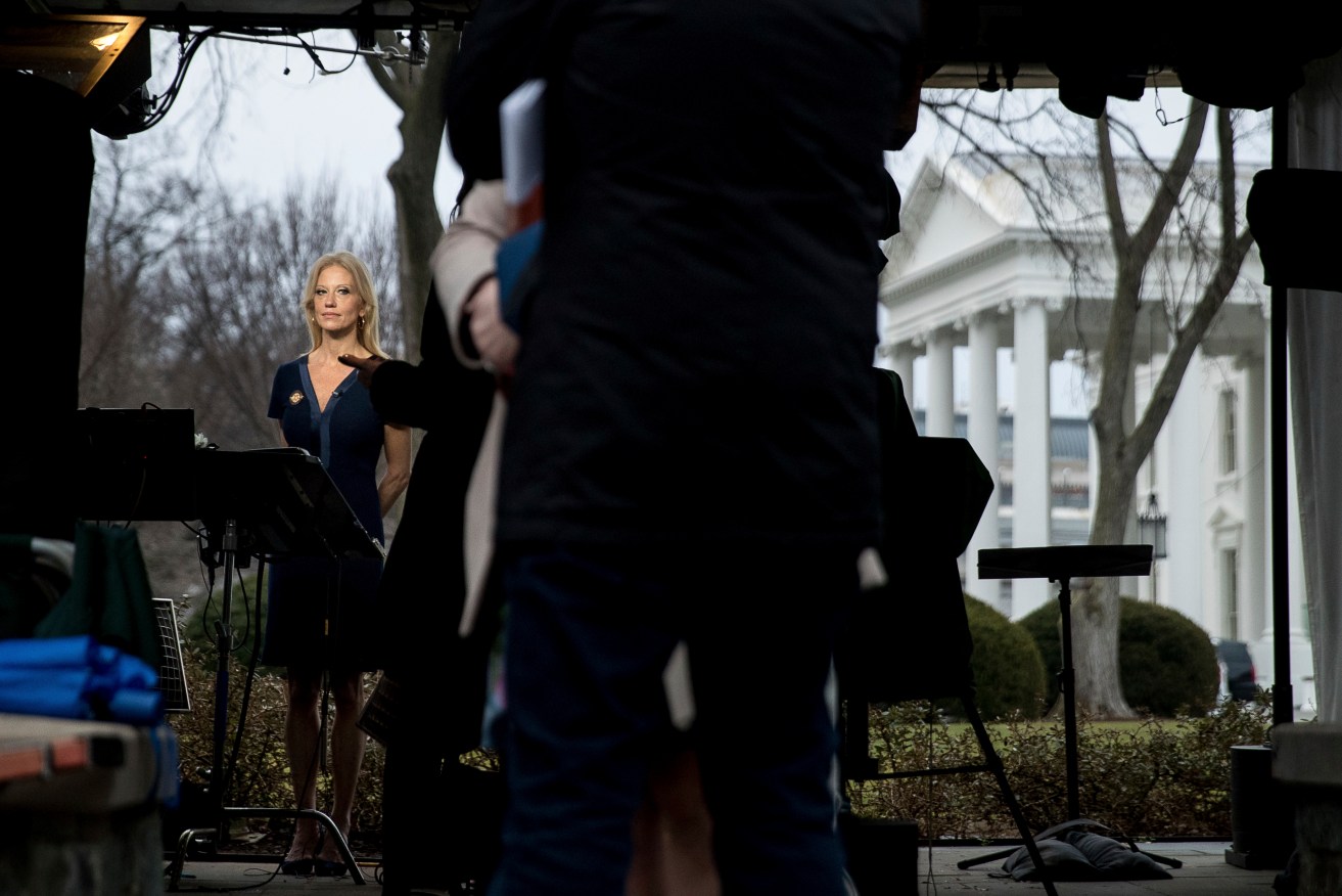 President Trump's senior adviser Kellyanne Conway gets ready to speak on television outside the White House. Photo: AP/Andrew Harnik
