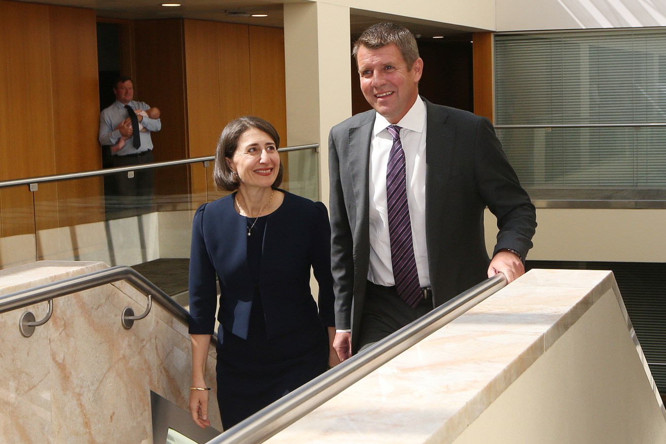 New NSW Premier Gladys Berejiklian and predecessor Mike Baird in Sydney this morning. Photo: AAP/David Moir