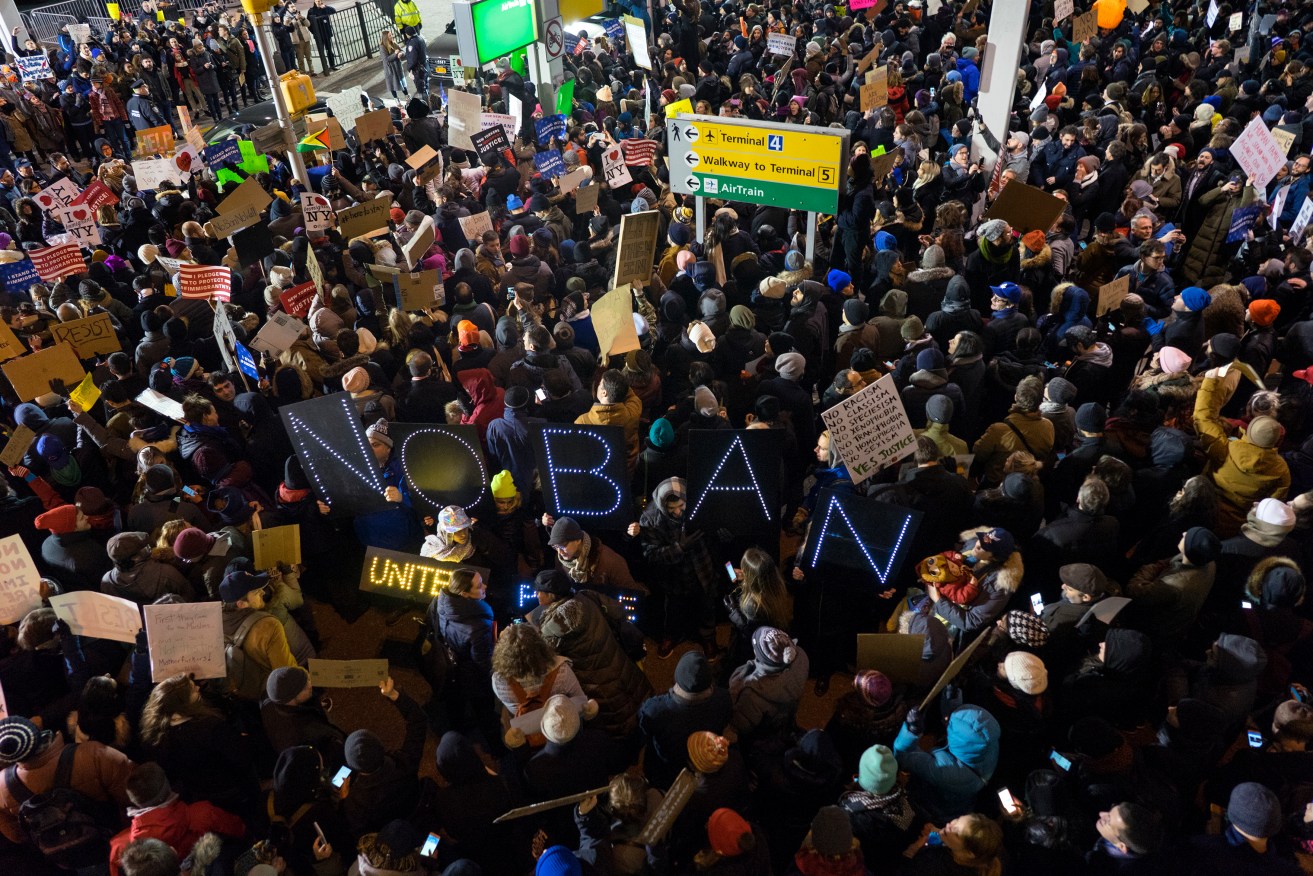 Protesters fill New York's John F. Kennedy International Airport. Photo: AP/Craig Ruttle