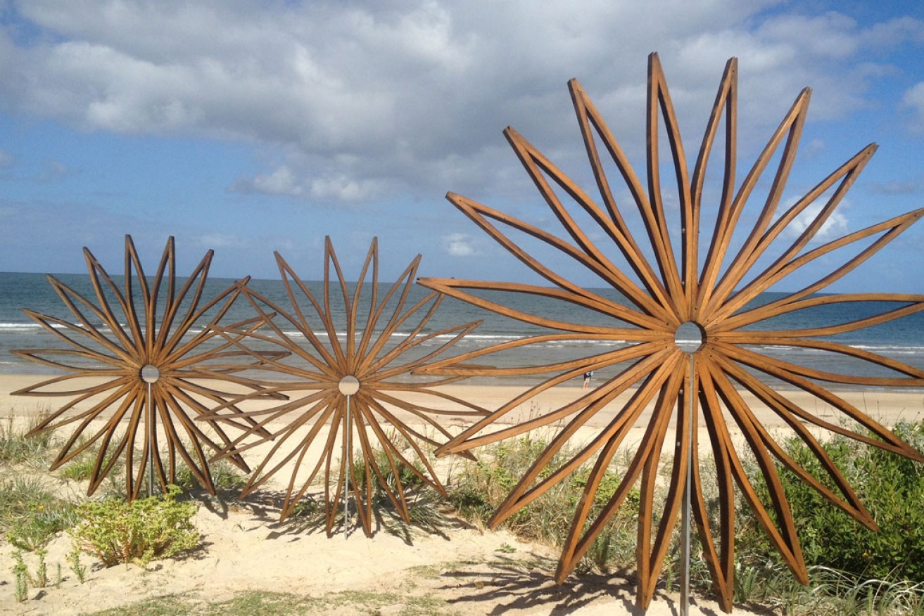 'The Sunflowers', by Quentin Gore, made of upcycled French oak wine barrel staves. It is part of the Brighton Jetty Classic Sculptures Exhibition.