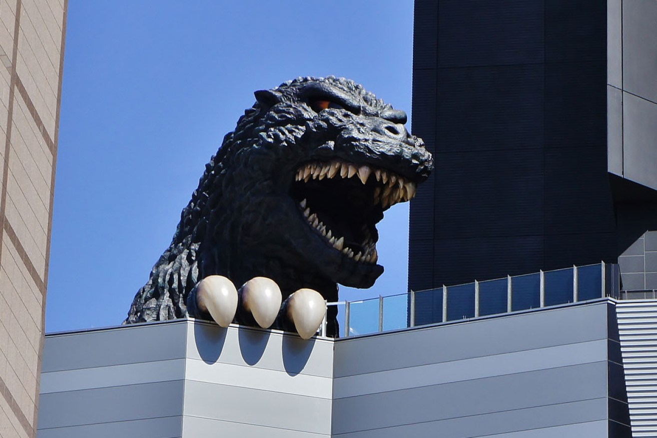 Godzilla emerges from the Toho Cinema building. Photo: Manish Prabhune / flickr