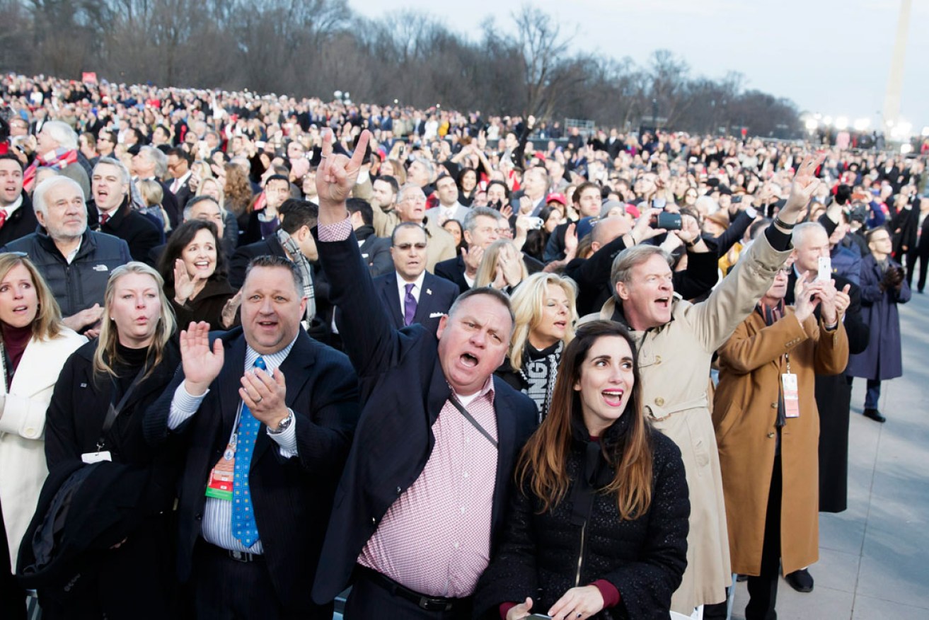 Audience members sing during the 'Make America Great Again! Welcome Celebration' for Donald Trump on a stage at the Lincoln Memorial on the eve of his inauguration. Photo: EPA