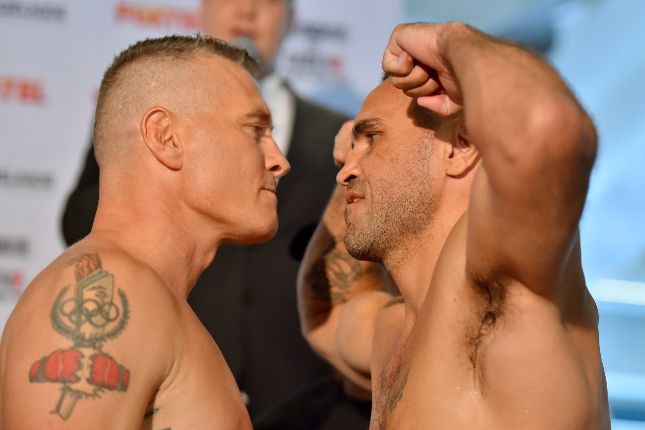 FACE-OFF: Danny Green and Anthony Mundine bring the obligatory trash-talk before tonight's bout. Photo: David Mariuz / AAP