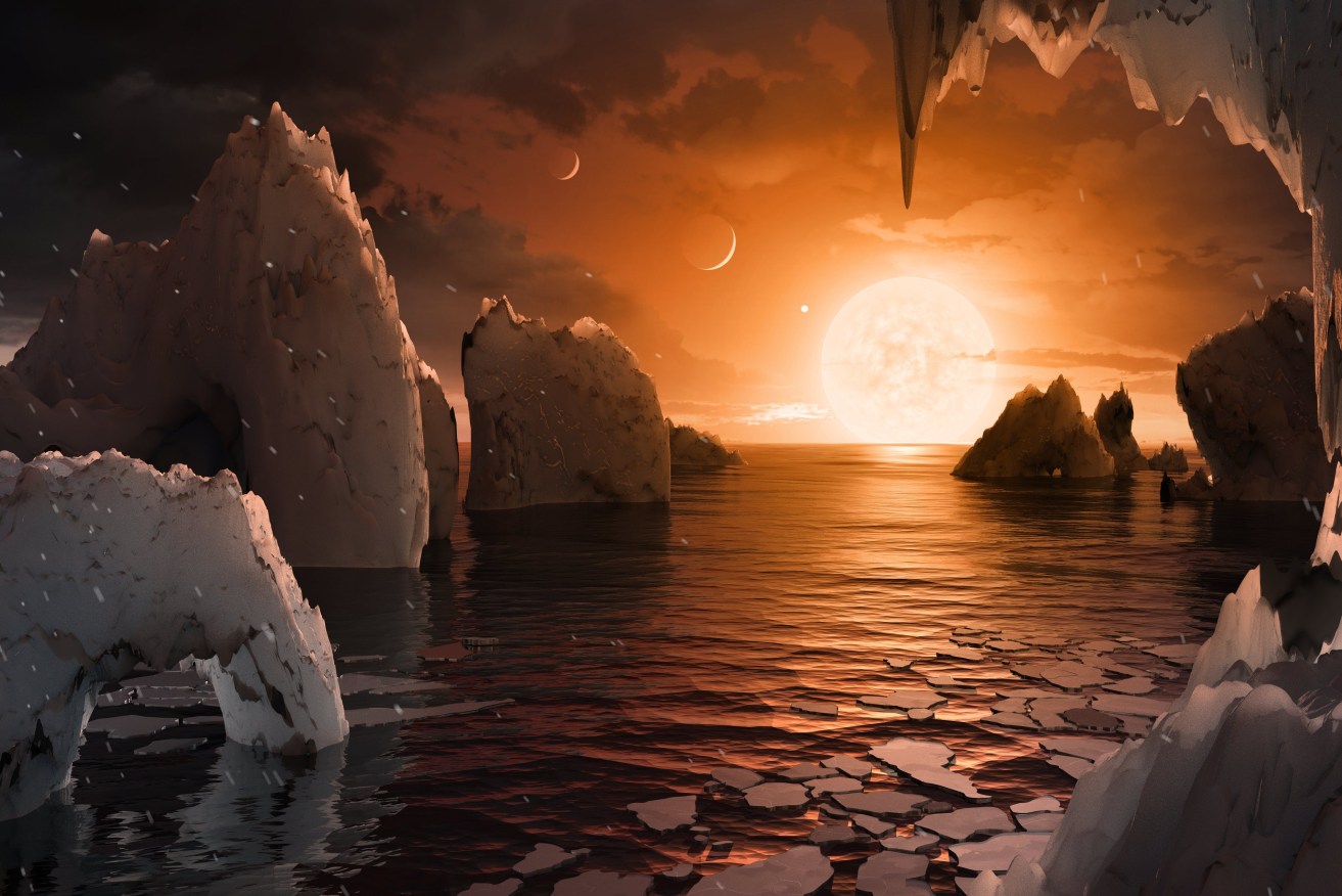 An artist's imagining of what it would be like to stand on the surface of the exoplanet TRAPPIST-1f. Because  the same face of the planet is thought to be always pointed at the star, there would be a region called the terminator that perpetually divides day and night. Photo: EPA/NASA/JPL-Caltech/T. Pyle (IPAC)