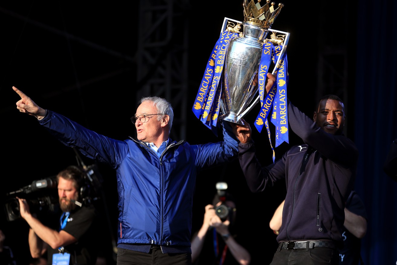 Claudio Ranieri and Leicester captain Wes Morgan with the championship trophy after a victory parade through Leicester City Centre. Nine months on, the club has terminated Ranieri's contract. Photo: Nick Potts / PA Wire