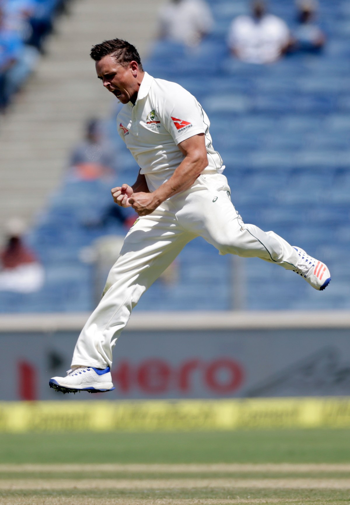 Australia's Steve O'Keefe celebrates after Virat Kohli's wicket during third day of the first cricket test match against India in Pune, India, Saturday, Feb. 25, 2017. (AP Photo/Rajanish Kakade)