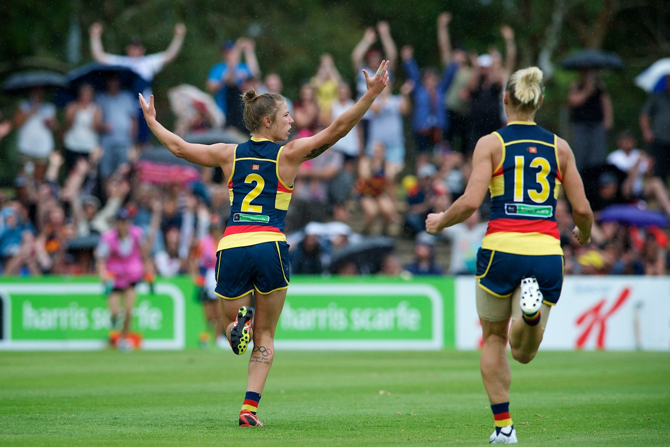 Kellie Gibson and Erin Phillips enjoy the moment as the Crows get their first goal in AFLW football. Photo: Michael Errey / InDaily