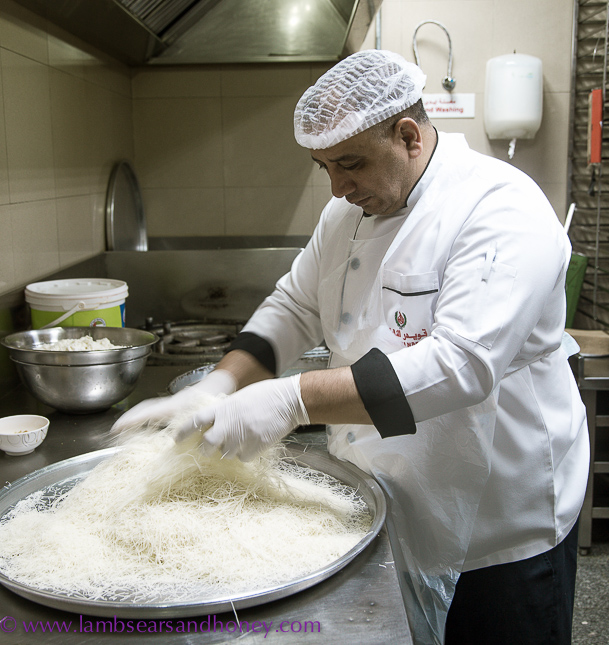 Preparing the shredded pastry base for the wickedly delicious kunafa. Photo: Amanda McInerney