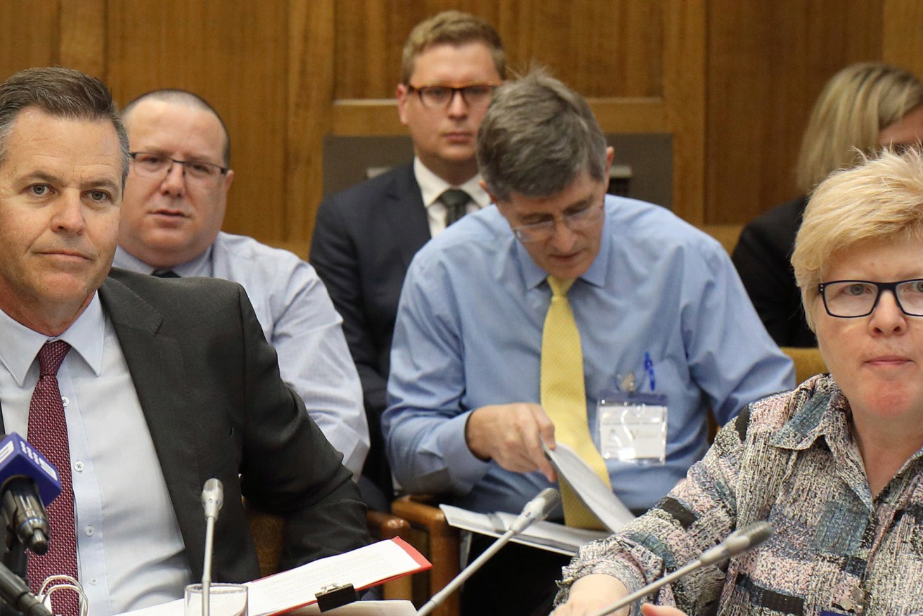 Sacked former Families SA boss Etienne Scheepers (centre right) takes a back seat at a recent parliamentary inquiry behind new Education CEO Rick Persse (left) and his deputy Julieann Riedstra. Photo: Tony Lewis / InDaily