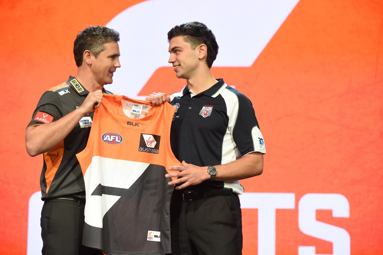 Number 2 draft pick Tim Taranto with GWS Giants coach Leon Cameron on draft night. Taranto will debut against the Crows. Photo: Dean Lewins / AAP