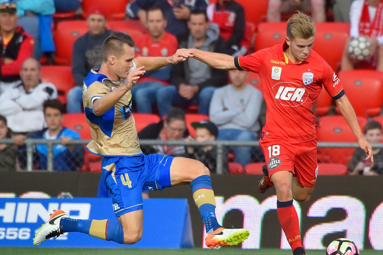 Riley McGree (right) in action for United last month. Photo: AAP/David Mariuz