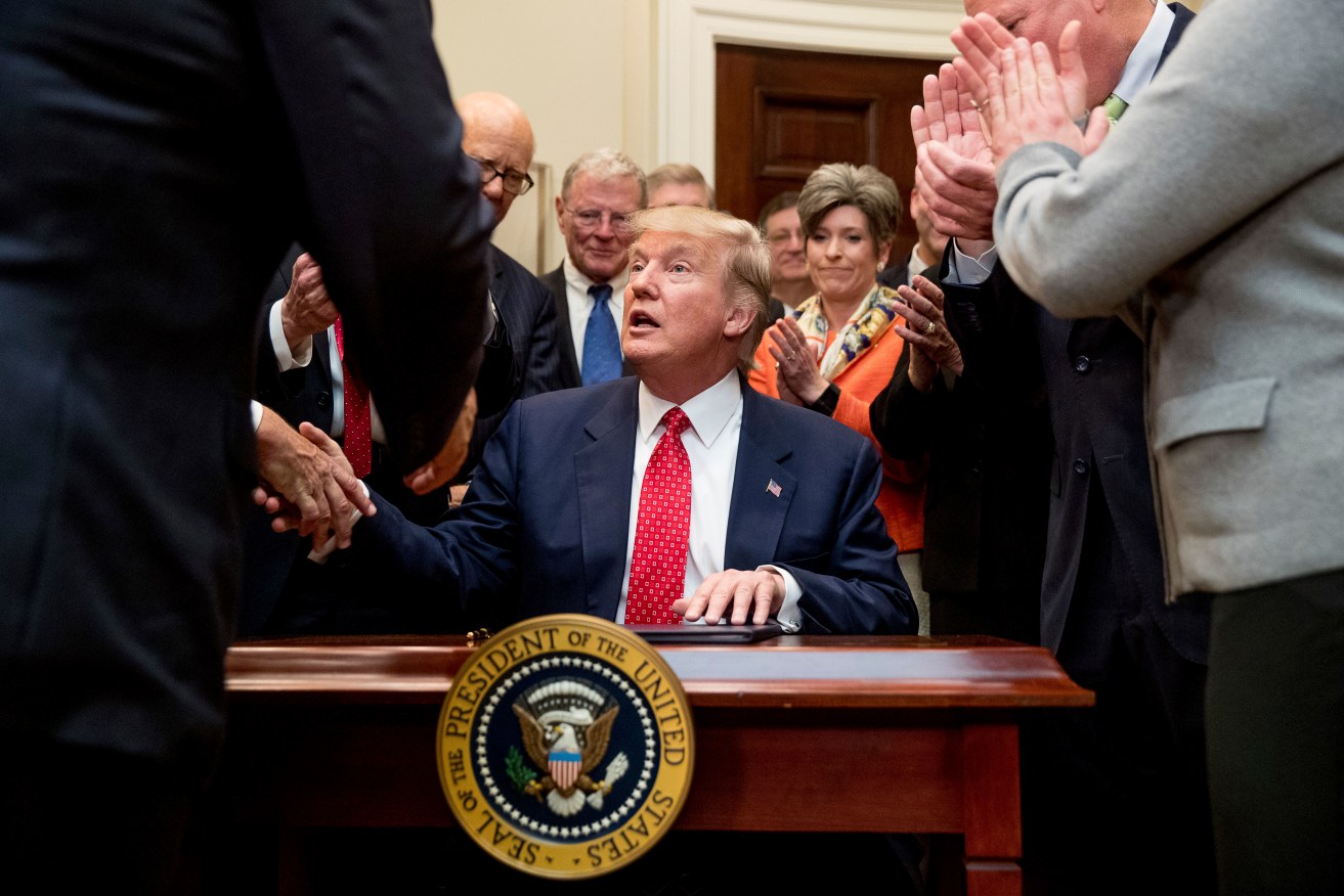 President Donald Trump  after signing an executive order in the Roosevelt Room of the White House. Photo: AP/Andrew Harnik