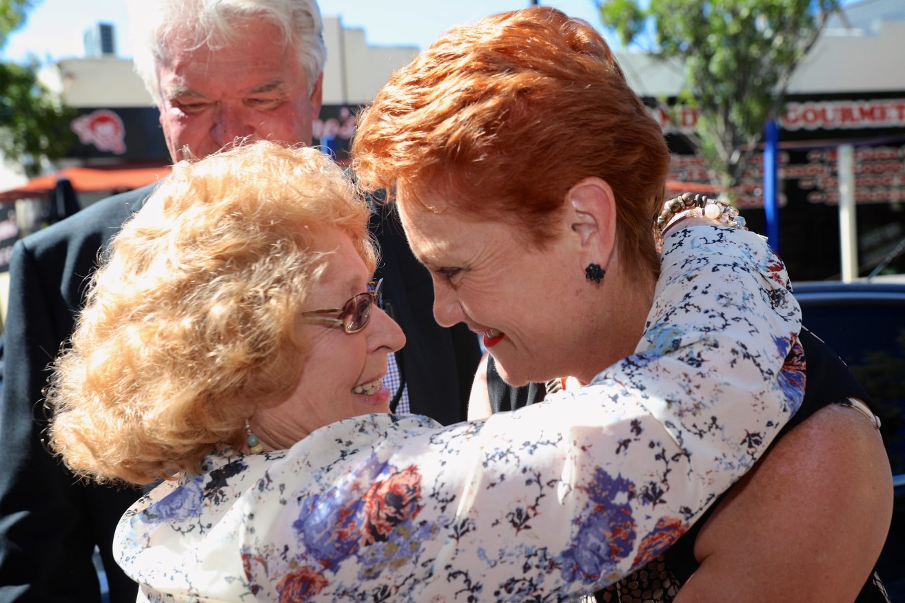 One Nation leader Pauline Hanson is greeted by a supporter while campaigning south of Perth. Photo: Richard Wainwright / AAP