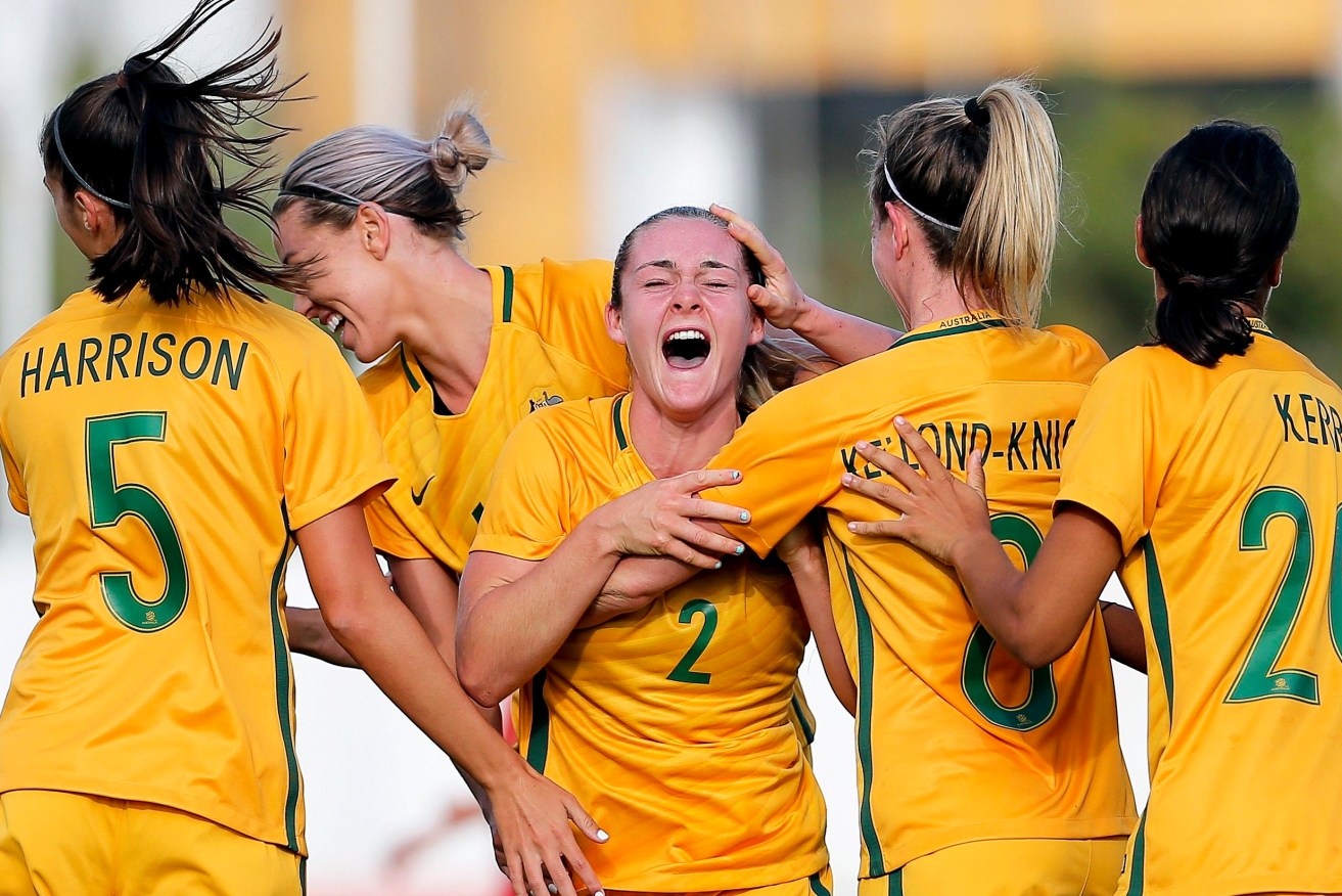 Ellie Carpenter celebrates with her teammates after putting Australia 2-1 up against China in the Algarve Cup. Photo: NUNO VEIGA / EPA