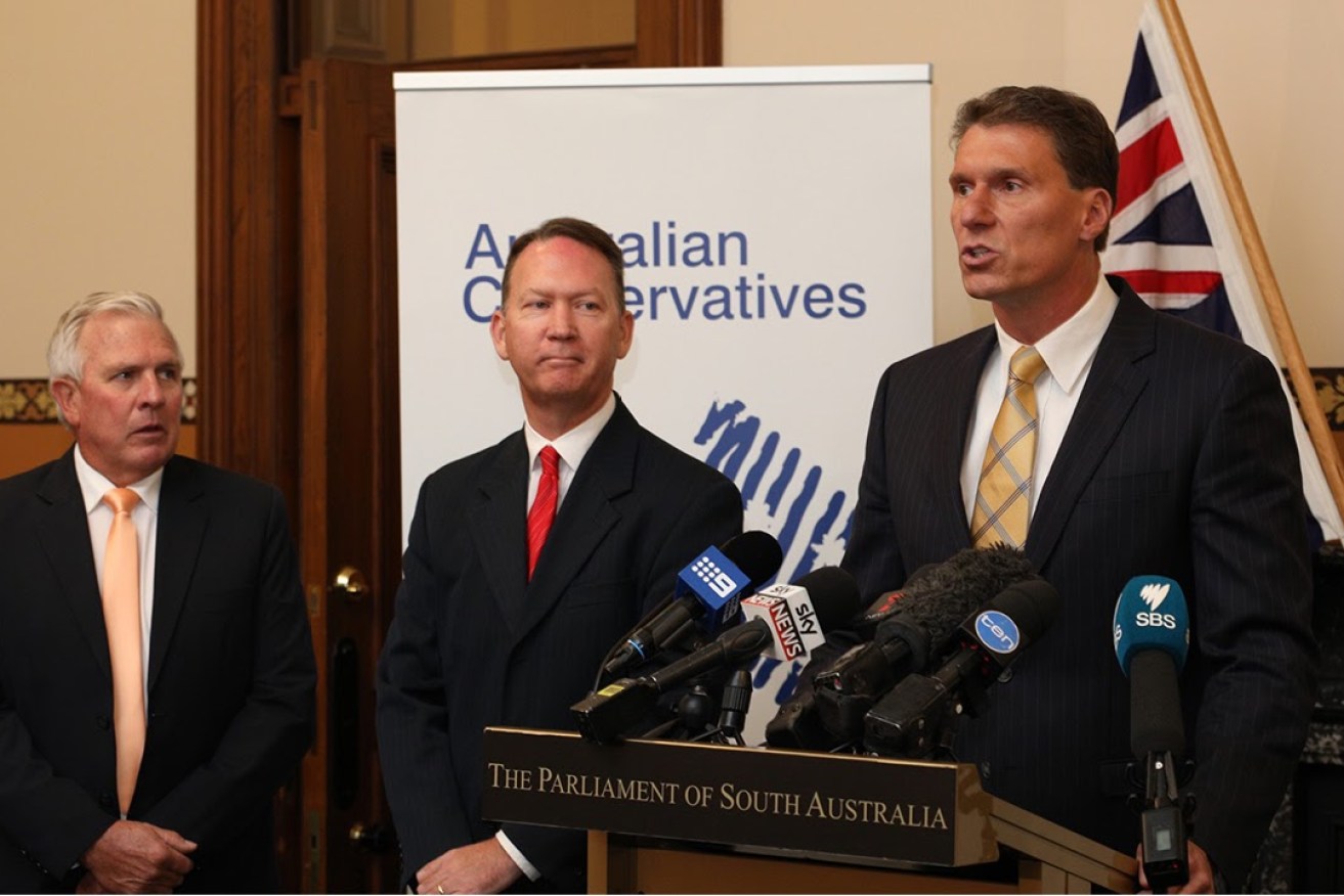 Cory Bernardi (right) announcing the "merger" with Family First today, joined by Dennis Hood (centre) and Rob Brokenshire. Photo: Tony Lewis/InDaily