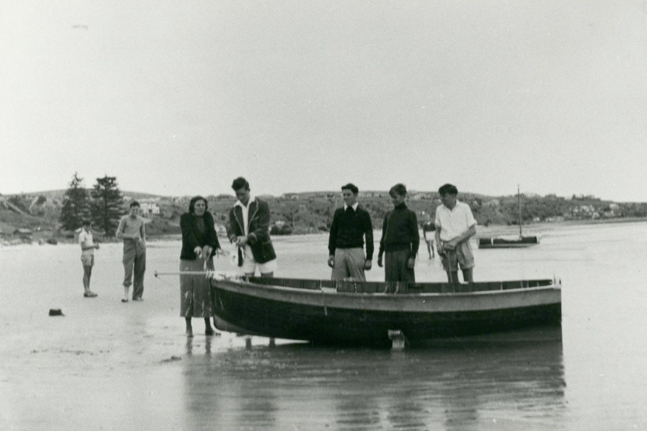 The naming ceremony at Brighton & Seacliff Yacht Club of Noc-too, the 12ft Cadet Dinghy Sir James built for Fred Neill c1953. Left to right: Florence (Flossy) Neill, Jim Hardy, John Neill, Rob Walker & Fred Neill. South Australian Maritime Museum Photographic Collection 16076