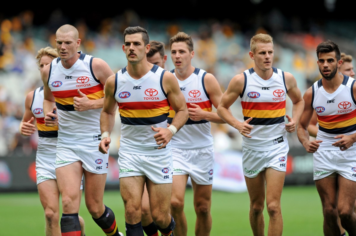 Adelaide crows players jog in for the half time break, during the Round 2 AFL match between the Hawthorn Hawks and the Adelaide Crows at the MCG in Melbourne, Saturday, April 1, 2017. (AAP Image/Joe Castro) NO ARCHIVING, EDITORIAL USE ONLY