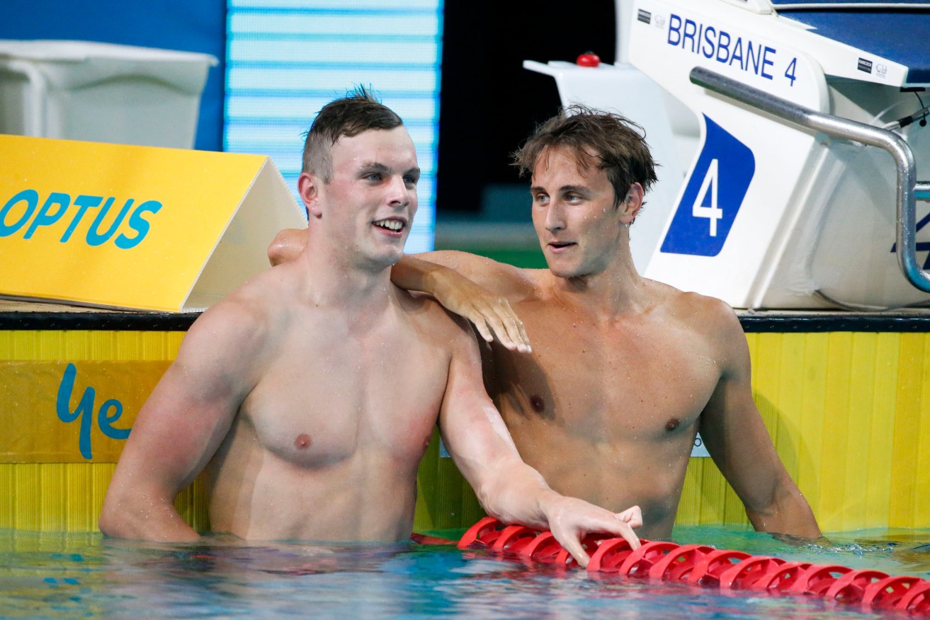 Kyle Chalmers gets a word of encouragement from Cameron McEvoy, who beat him to win the Men's 100m Freestyle at the Australian Swimming Championships. Photo: Glenn Hunt / AAP