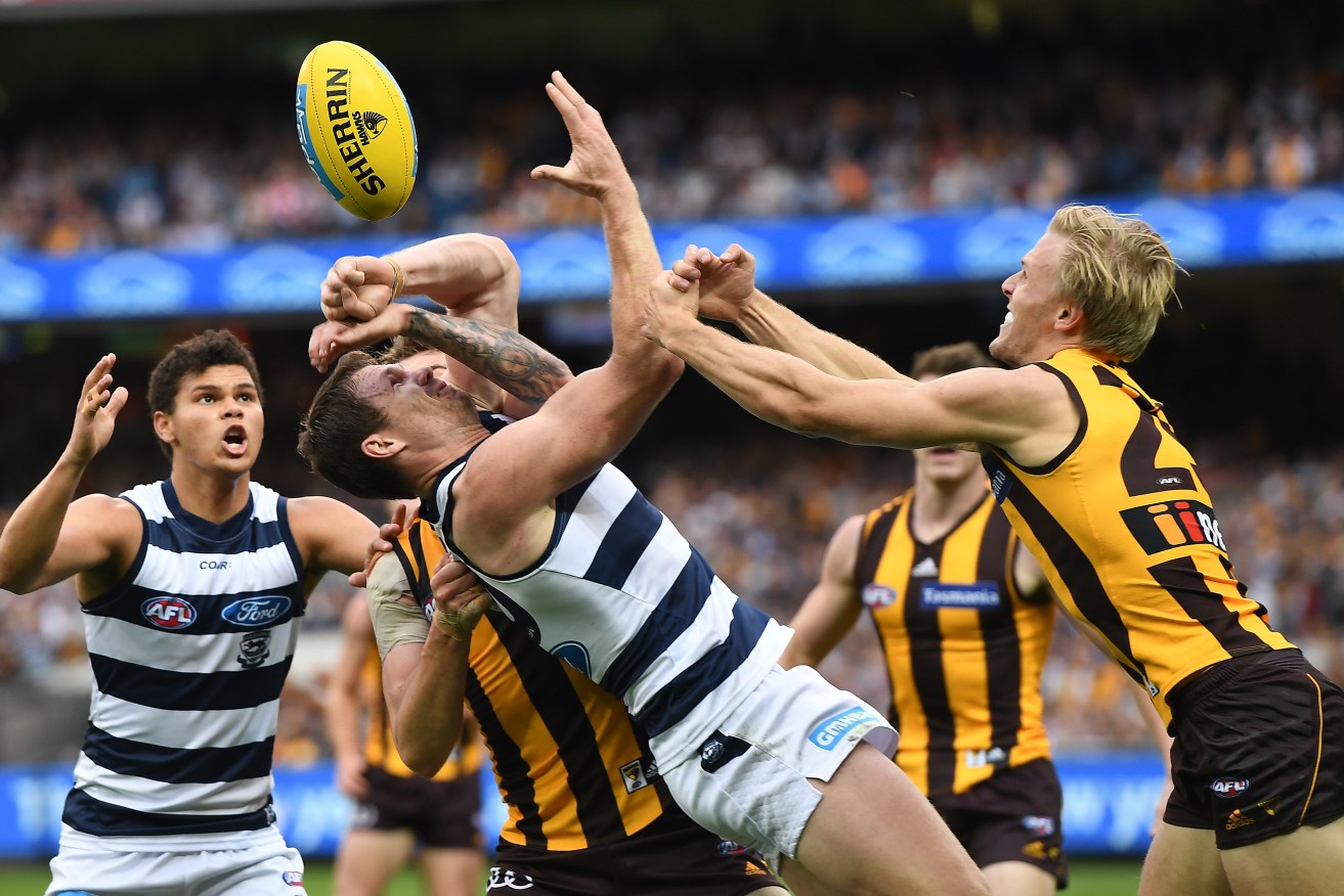 Geelong's Patrick Dangerfield (third from left) in the thick of the action at the MCG yesterday. Photo: AAP/Julian Smith