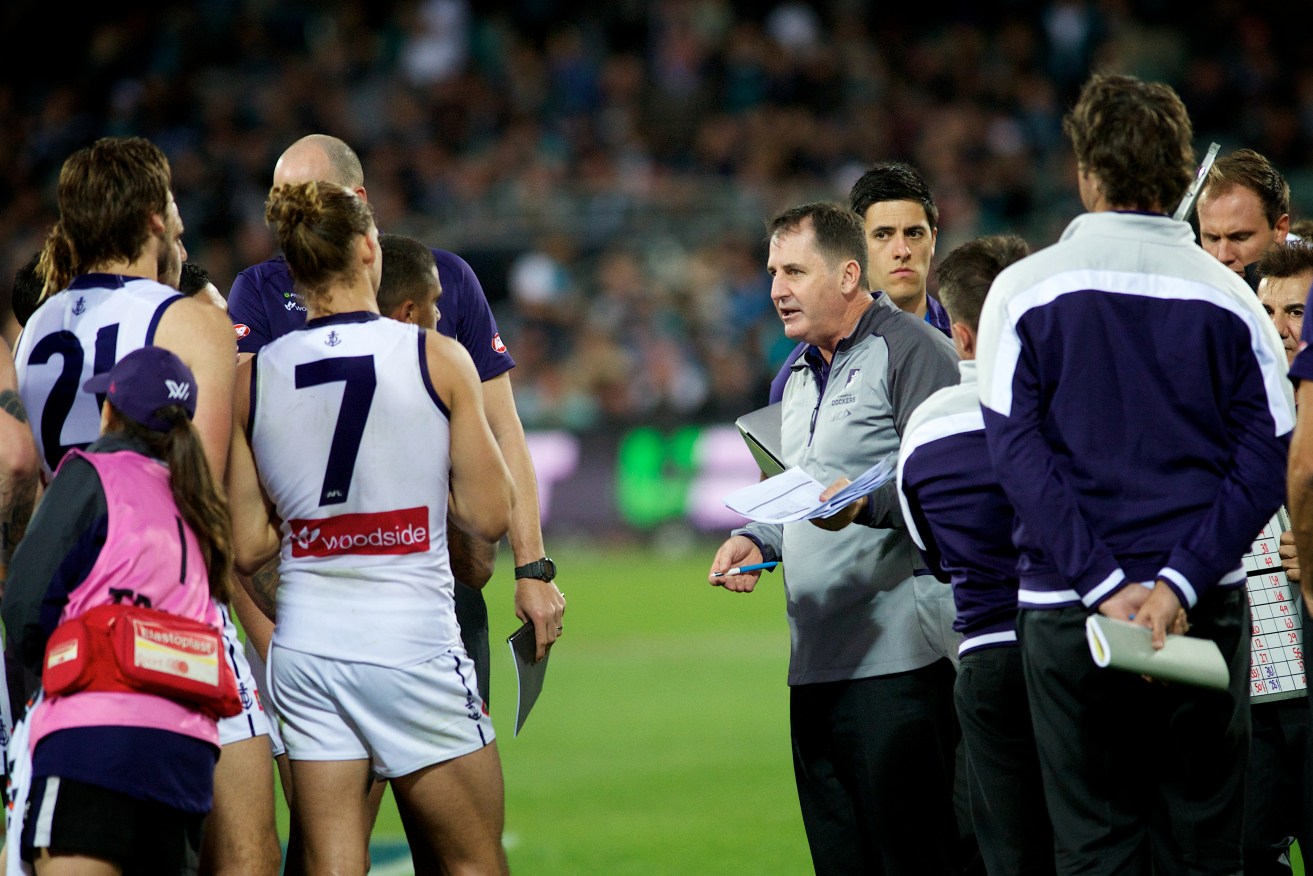 Nat Fyfe and the playing group listen to coach Ross Lyon during Sunday's drubbing by Port Adelaide. Photo: Michael Errey / InDaily