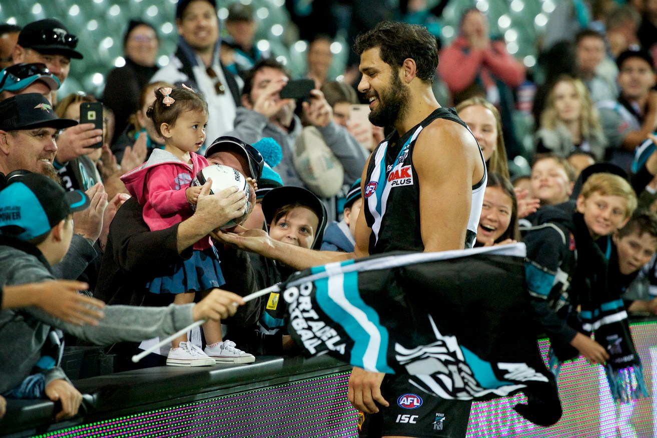 Paddy Ryder shares the fans' joy after the win. Photo: Michael Errey / InDaily