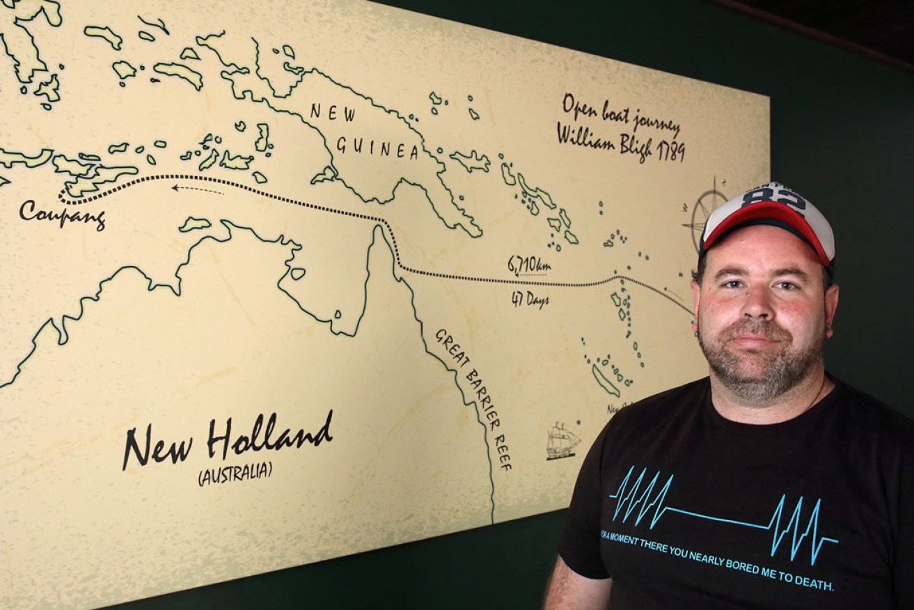 Jarrod Hales with the canvas that hangs on the mezzanine level of The William Bligh. Photo: Tony Lewis