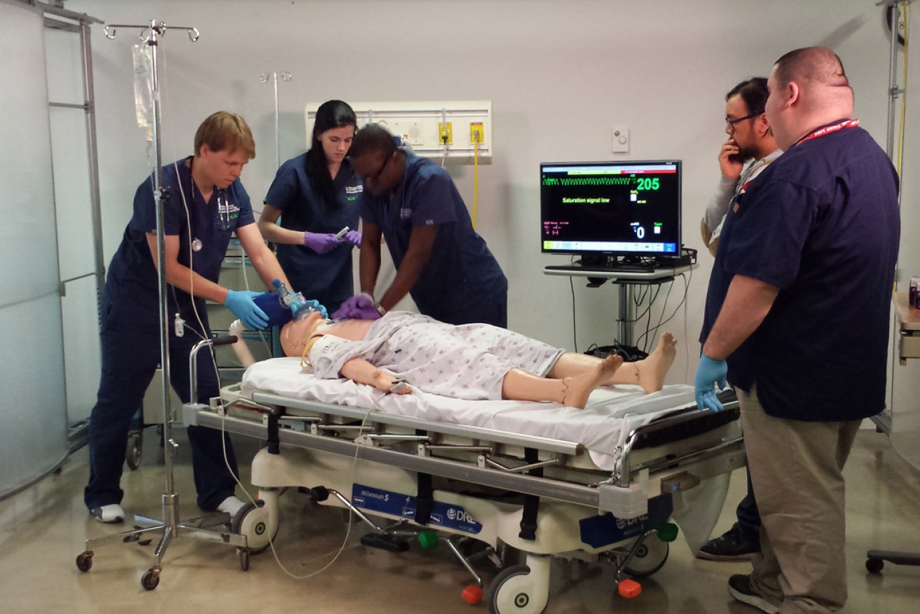A team of medical staff in a US hospital, being assessed using the Learning Experience Builder software while treating a mock patient having a heart attack. Image: supplied.